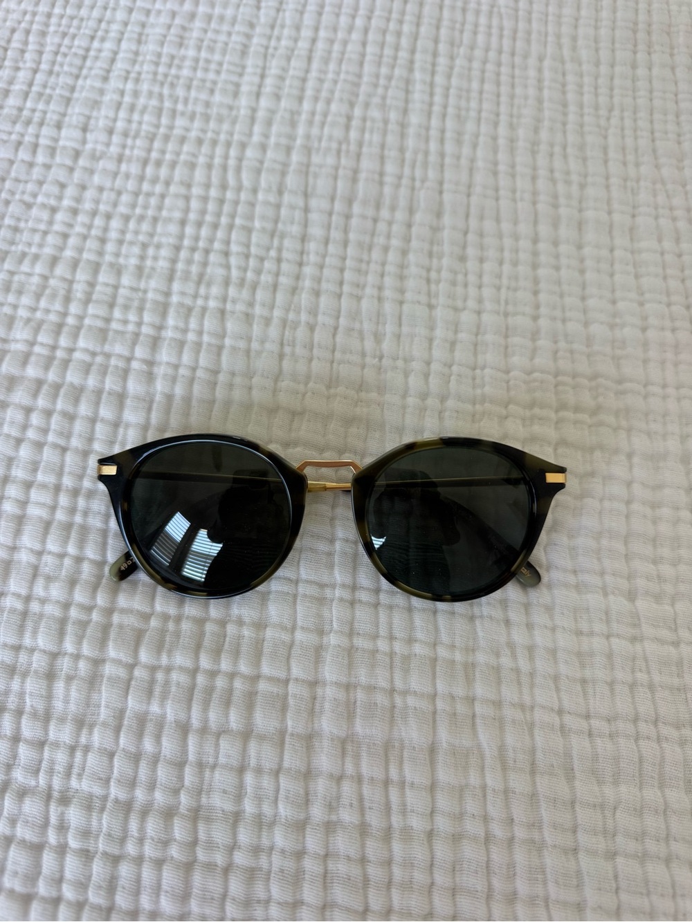 India Hicks Round Tortoise Sunglasses with Gold Bridge and Dark Lenses